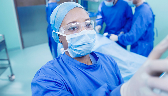 Woman in scrubs working in an OR