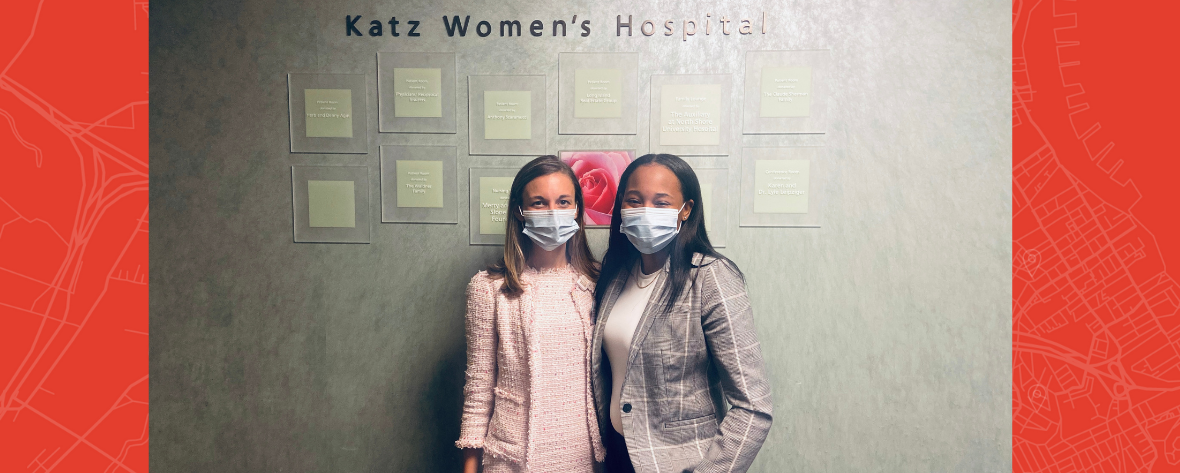 2 people in masks standing in front of