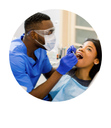 A dental professional working on a patient