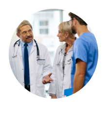 Group of three medical professionals conferring