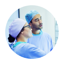 Two medical professionals conferring with each other
