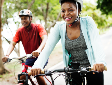 Man and woman riding bikes