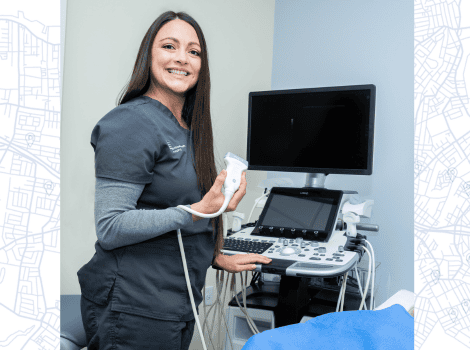 Photo of Jessica next to an ultrasound machine