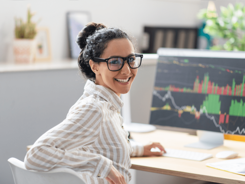 Woman smiling while working at her desk